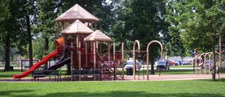 Children playing on park playground equipment