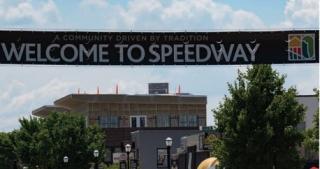 Welcome to Speedway banner over Main Street buildings