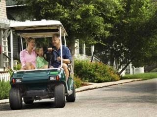 Golf cart on town street