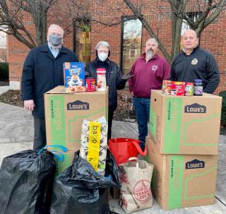 Volunteers delivering food drive items to food pantries