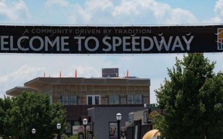 Welcome to Speedway banner over Main Street buildings