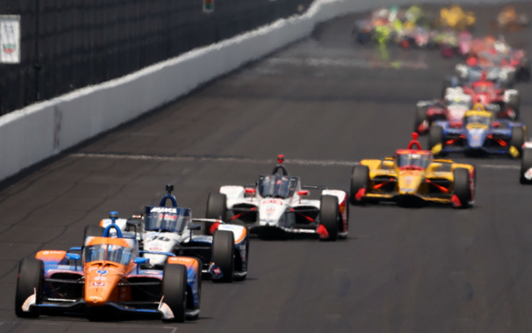 Indy 500 race cars on track
